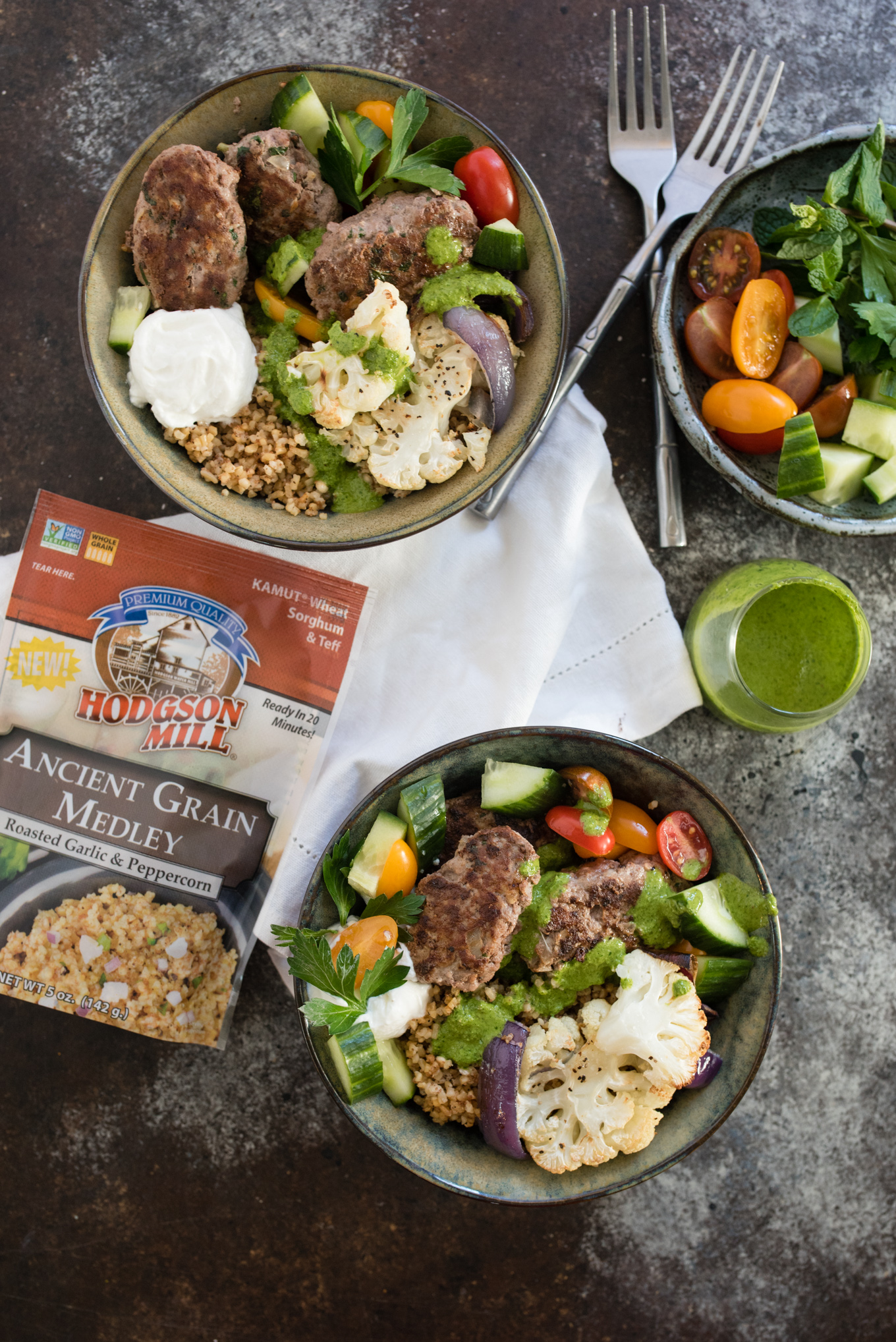 This Beef and Grain Kofta bowl takes Middle Eastern inspired meatballs and pairs them with a hearty flavorful grain and some veggies for a nutrition packed meal!