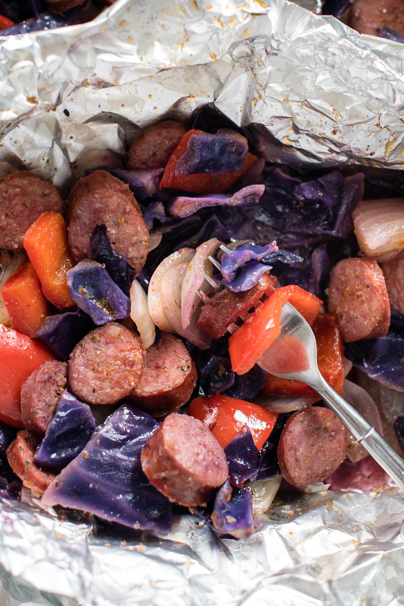 Cajun Sausage and Vegetable Foil Packets can be assembled in less than 10 minutes, and are protein rich, fiber packed and gluten free.