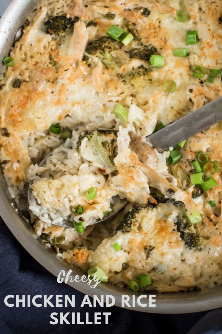 spoon in pan of chicken and rice