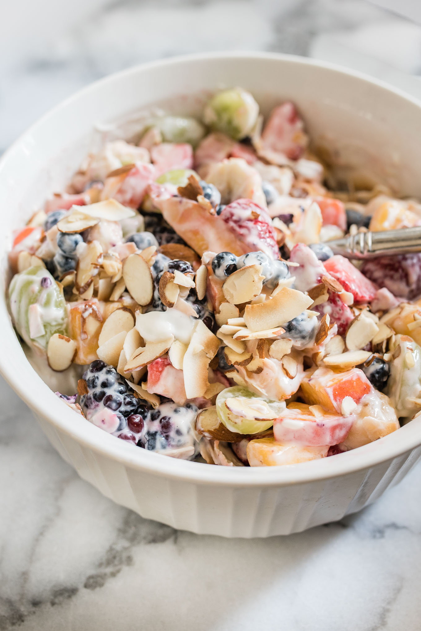 Fruit Salad with Lime Yogurt Dressing is a tangy sweet side dish and is a perfect gluten-free addition to a light breakfast, potluck or brunch.