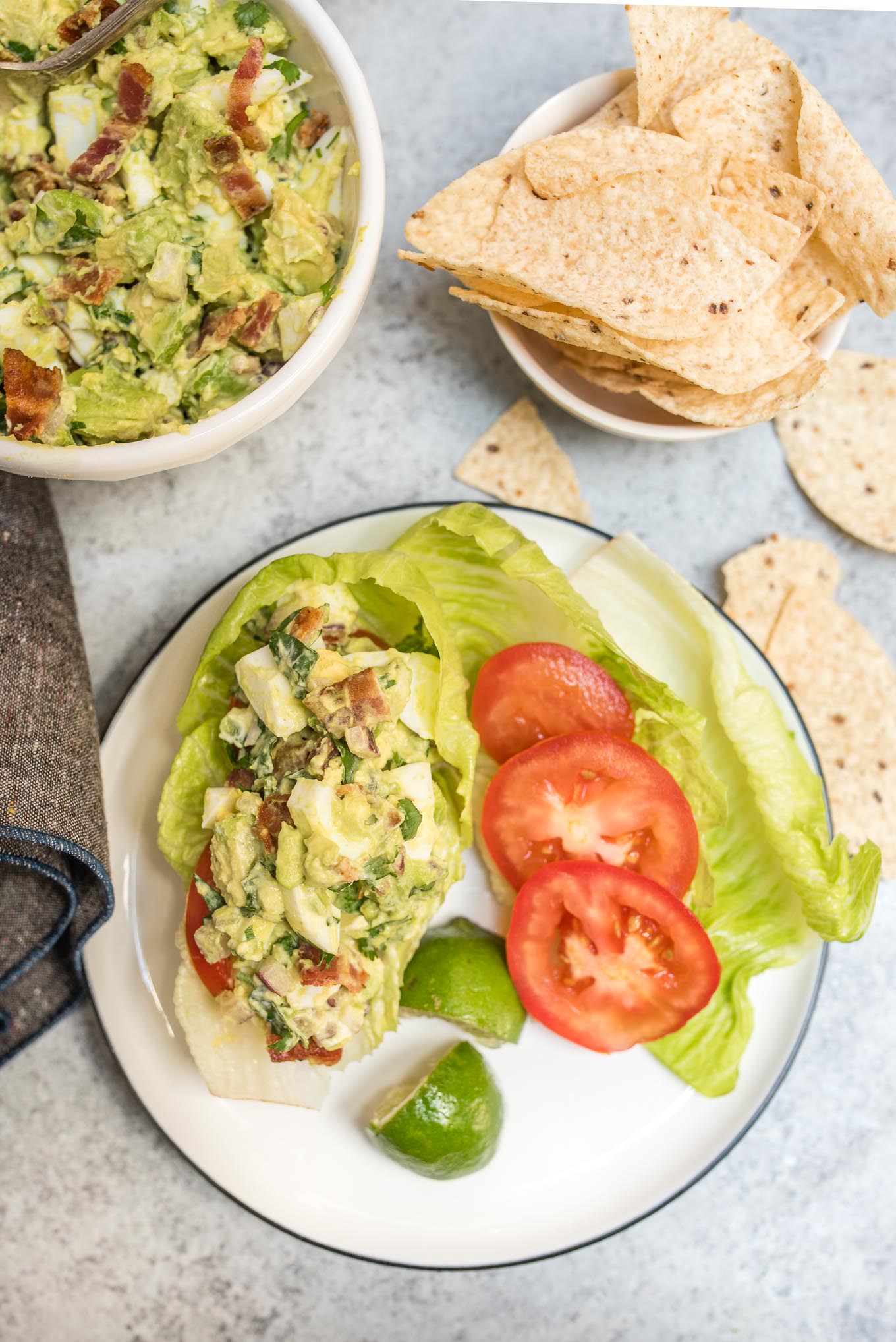 Guacamole Egg Salad tastes like that perfect guacamole recipe, but a little heartier with the addition of eggs and bacon. It makes a great dip, sandwich or salad topping.