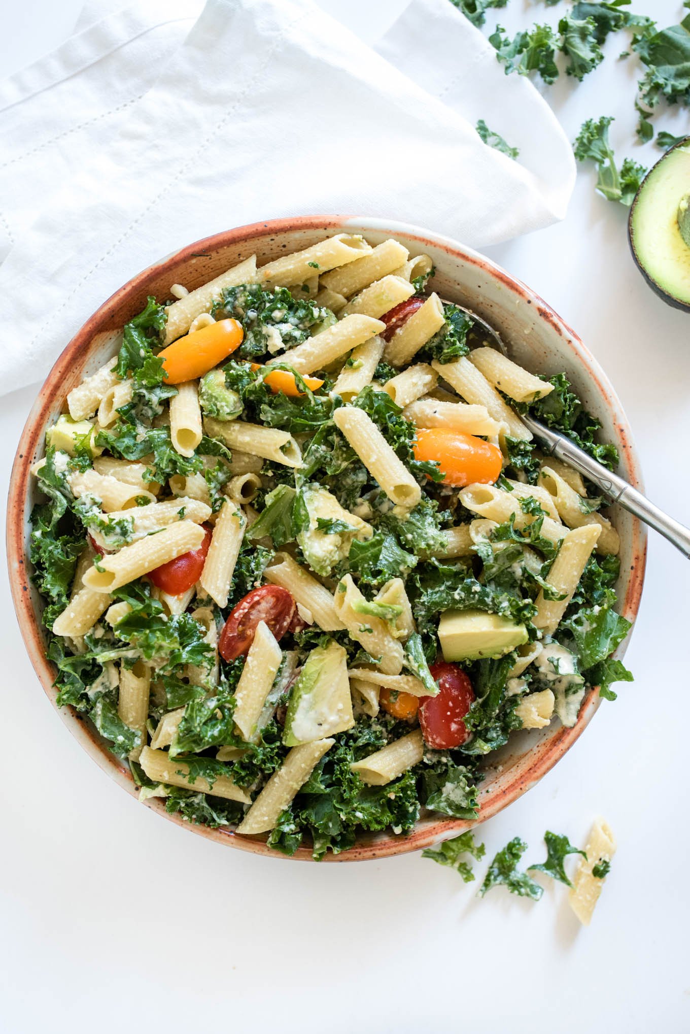 Kale Caesar Pasta Salad is a great vegetarian pasta salad packed with kale, avocado and a simple homemade Caesar dressing. 