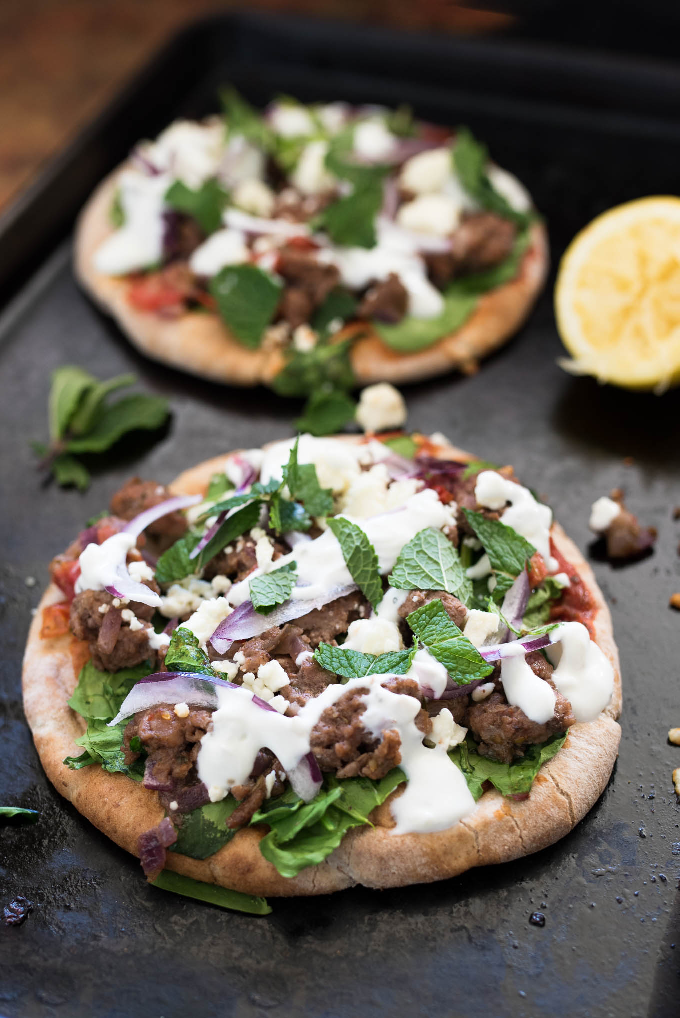 Lamb and Spinach Pita Pizza uses convenient pita bread for the crust and is flavor packed dish ready in under 30 minutes. 