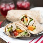 Mediterranean Chicken Wrap- Greek Salad, hummus and seasoned chicken make up this tasty wrap. Great for leftovers or a make-ahead meal! | 