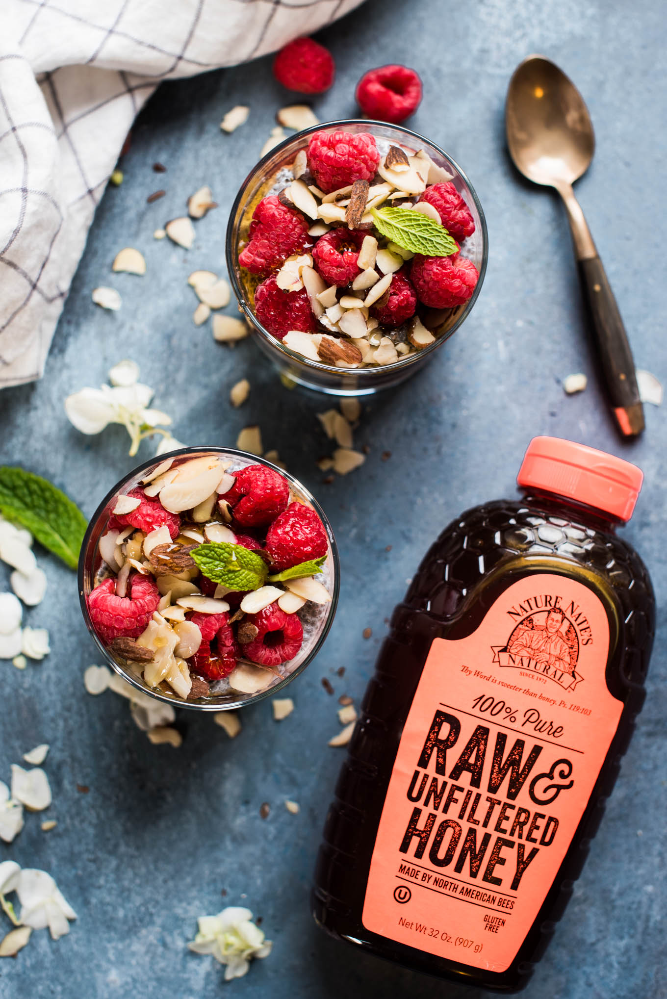 Raspberry Chia Parfait with honey on the table 