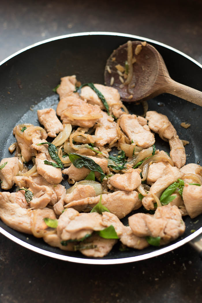 Spicy Thai Basil Chicken | super simple, flavorful and ready in under 20 minutes! You don' have to be an experienced Thai cook to make this Thai inspired dish! | 